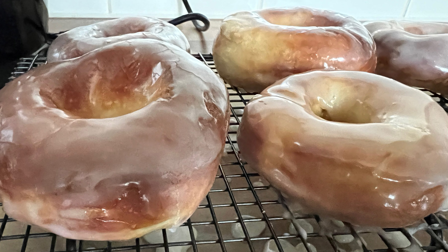 A close-up of air fryer donuts that have been glazed