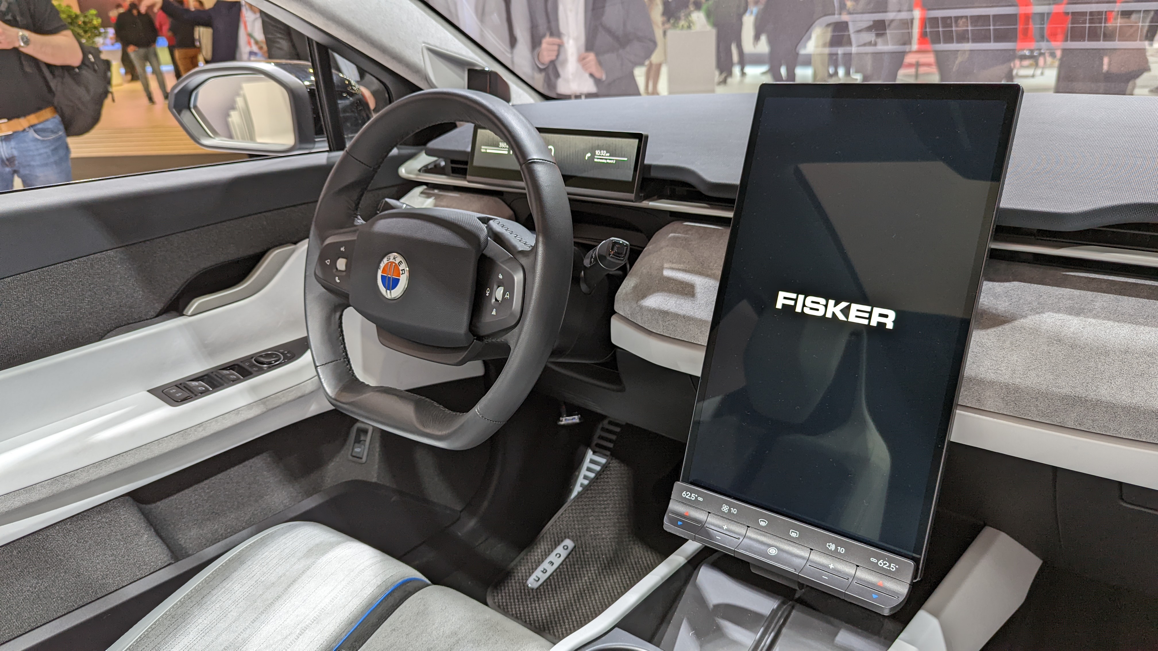 Steering wheel and portrait central screen