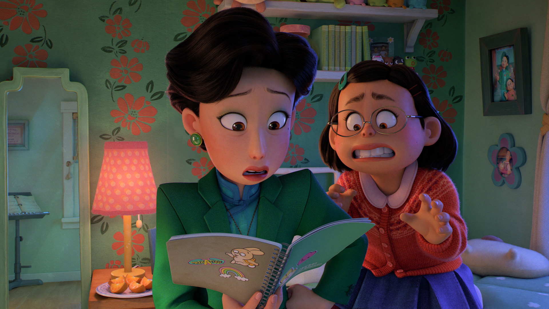 Meilin Lee tries to grab her notebook from her mom in Pixar's Turning Red